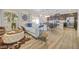 Inviting living area features natural light, wood floors, and open floor plan at 4465 Shimmering Skies St # 1177, North Las Vegas, NV 89031