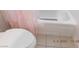 Bathroom featuring a toilet, tile flooring, and tub with pink shower curtain at 4663 Sand Creek Ave, Las Vegas, NV 89103