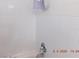 Tiled shower featuring a towel bar and shower head at 4663 Sand Creek Ave, Las Vegas, NV 89103