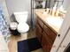 Functional bathroom with a toilet, vanity with sink, and neutral wall color at 4663 Sand Creek Ave, Las Vegas, NV 89103