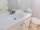 Bathroom featuring a white sink, chrome faucet, and white cabinets at 4663 Sand Creek Ave, Las Vegas, NV 89103