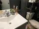 Modern bathroom vanity with decorative items and a toilet at 4663 Sand Creek Ave, Las Vegas, NV 89103