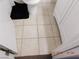 Close up of the tiled bathroom floor, toilet, and vanity at 4663 Sand Creek Ave, Las Vegas, NV 89103