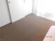 Bedroom with tan carpet and bright natural light from the window at 4663 Sand Creek Ave, Las Vegas, NV 89103