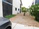 Modest apartment complex with xeriscaping, wrought iron doors, and an adjacent sidewalk and parking area at 4663 Sand Creek Ave, Las Vegas, NV 89103