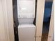 A white stacked washer and dryer laundry center at 4663 Sand Creek Ave, Las Vegas, NV 89103
