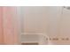 Shower showcasing white tile walls and a pink shower curtain at 4663 Sand Creek Ave, Las Vegas, NV 89103