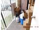 Cramped storage area filled with boxes, gas tank, cleaning supplies, and various household items at 4663 Sand Creek Ave, Las Vegas, NV 89103