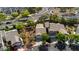 Aerial view of a property highlighting the mature landscaping, nearby parking, and well-maintained community at 504 Painted Cloud Pl, Las Vegas, NV 89144