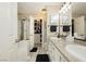 Elegant bathroom with double sinks, granite countertops, and a separate shower for a spa-like experience at 504 Painted Cloud Pl, Las Vegas, NV 89144