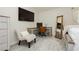 Stylish bedroom featuring a desk, chair, full-length mirror, and a bright and comfortable atmosphere at 504 Painted Cloud Pl, Las Vegas, NV 89144