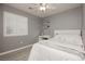 Bedroom featuring bright windows, shutters, desk, and neutral color palette at 504 Painted Cloud Pl, Las Vegas, NV 89144
