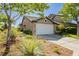 Charming single-story home with desert landscaping and a two-car garage at 504 Painted Cloud Pl, Las Vegas, NV 89144