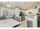 Bright kitchen featuring stainless steel appliances, white cabinets, and a dining area perfect for Gathering meals at 504 Painted Cloud Pl, Las Vegas, NV 89144