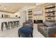 Comfortable living room with stacked stone fireplace wall, mantel, and built-in shelving at 504 Painted Cloud Pl, Las Vegas, NV 89144