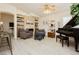 Stylish living room featuring a stone fireplace, sleek furniture, and plank flooring at 504 Painted Cloud Pl, Las Vegas, NV 89144
