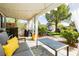 Inviting covered patio with comfortable seating, a lush garden, and a tranquil outdoor space at 504 Painted Cloud Pl, Las Vegas, NV 89144