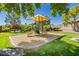 Community playground featuring slides and covered play area, surrounded by green space at 504 Painted Cloud Pl, Las Vegas, NV 89144