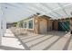 Community pool area featuring a covered patio with tables, showers, and nearby facilities at 504 Painted Cloud Pl, Las Vegas, NV 89144