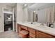 Bathroom featuring double sinks, and a separate room with a combination shower and bathtub at 506 Chestnut View Pl, Henderson, NV 89052