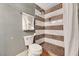 Updated bathroom features a tiled shower, modern fixtures, and neutral paint, creating a clean and relaxing space at 506 Chestnut View Pl, Henderson, NV 89052