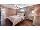 Comfortable bedroom features a ceiling fan, carpet, and great natural light at 506 Chestnut View Pl, Henderson, NV 89052