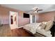 Comfortable bedroom features a ceiling fan, carpet, and great natural light at 506 Chestnut View Pl, Henderson, NV 89052