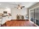 Bright dining area with hardwood floors, textured wall paneling, and sliding doors to the backyard at 506 Chestnut View Pl, Henderson, NV 89052