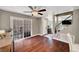 Dining area with hardwood floors, chandelier and a view of the back patio through sliding glass doors at 506 Chestnut View Pl, Henderson, NV 89052