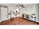 Bright dining area featuring white wall paneling, hardwood floors, and modern light fixture at 506 Chestnut View Pl, Henderson, NV 89052