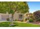 Charming home featuring a well-manicured lawn, mature tree, and lovely garden, perfect for curb appeal at 506 Chestnut View Pl, Henderson, NV 89052