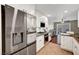 Bright and modern kitchen with stainless steel refrigerator and ample storage at 506 Chestnut View Pl, Henderson, NV 89052