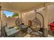 Relaxing covered patio features cozy seating arrangements, perfect for outdoor lounging and entertaining at 506 Chestnut View Pl, Henderson, NV 89052