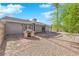 Backyard view with built-in barbecue, concrete patio, and decorative rock ground cover at 5162 Somerset Dr, Las Vegas, NV 89120