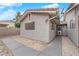 Exterior view of backyard showcasing the home's architecture, gravel landscaping and covered patio at 5162 Somerset Dr, Las Vegas, NV 89120