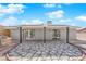 Backyard patio with built-in grill, French doors to living area, and decorative rock features at 5162 Somerset Dr, Las Vegas, NV 89120