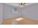 Simple bedroom with ceiling fan, window, and neutral walls at 5162 Somerset Dr, Las Vegas, NV 89120