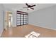 Bedroom with wood floors and a large window and closet doors at 5162 Somerset Dr, Las Vegas, NV 89120