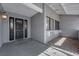 View of covered front porch with decorative glass in the front door at 5162 Somerset Dr, Las Vegas, NV 89120