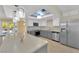 Bright kitchen boasts stainless appliances, island and skylight at 5162 Somerset Dr, Las Vegas, NV 89120