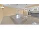Spacious living room with tile floors, access to the kitchen and backyard at 5162 Somerset Dr, Las Vegas, NV 89120