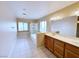 Bathroom featuring a soaking tub, shower, double sink vanity, and tile flooring at 5704 Burdel St, Las Vegas, NV 89149
