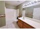 Bathroom featuring a shower-tub combo, decorative wallpaper border, and a single sink vanity at 5704 Burdel St, Las Vegas, NV 89149