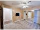 Cozy bedroom with neutral carpet, a ceiling fan, and mirrored closet doors for added space at 5704 Burdel St, Las Vegas, NV 89149