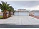 Lovely single-story home featuring a wide driveway and three-car garage at 5704 Burdel St, Las Vegas, NV 89149