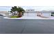 Charming single-story home with a three-car garage and desert landscaping at 5704 Burdel St, Las Vegas, NV 89149