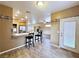 Kitchen featuring wood floors, an open breakfast bar, and a view into the living room at 5704 Burdel St, Las Vegas, NV 89149