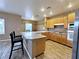 Kitchen featuring bar seating with granite countertops at 5704 Burdel St, Las Vegas, NV 89149