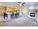Open living space combining living room, kitchen, and fireplace at 5704 Burdel St, Las Vegas, NV 89149