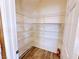 Walk-in pantry features wire shelving on a wood floor, providing ample storage space at 5704 Burdel St, Las Vegas, NV 89149